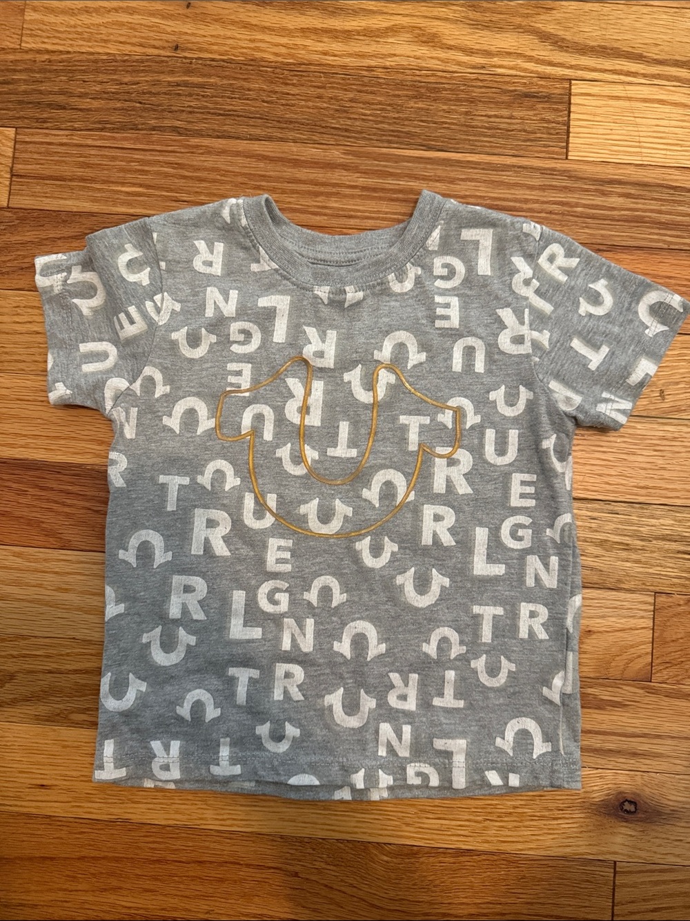 True Religion Gray Tee with White Lettering and Gold Outline Smile